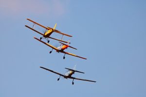 Monoplane and biplanes flying together