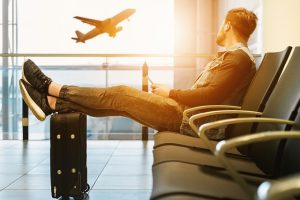 Guy sitting with luggage